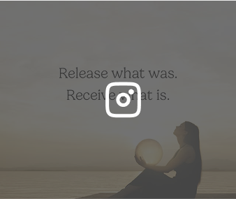 Silhouette of woman holding a glowing orb