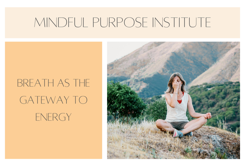 A woman sits cross-legged outdoors on a hillside, practicing alternate nostril breathing with mountains in the background, symbolizing yoga breathwork as a gateway to energy.